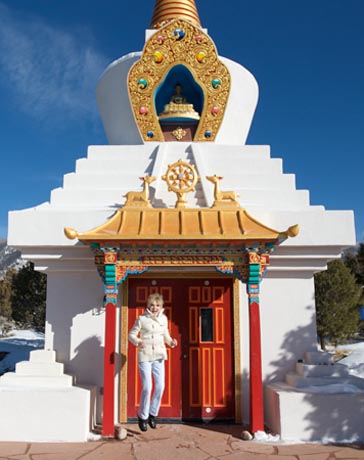 Ellen Wood, jumping with joy at Buddhist temple, NM
